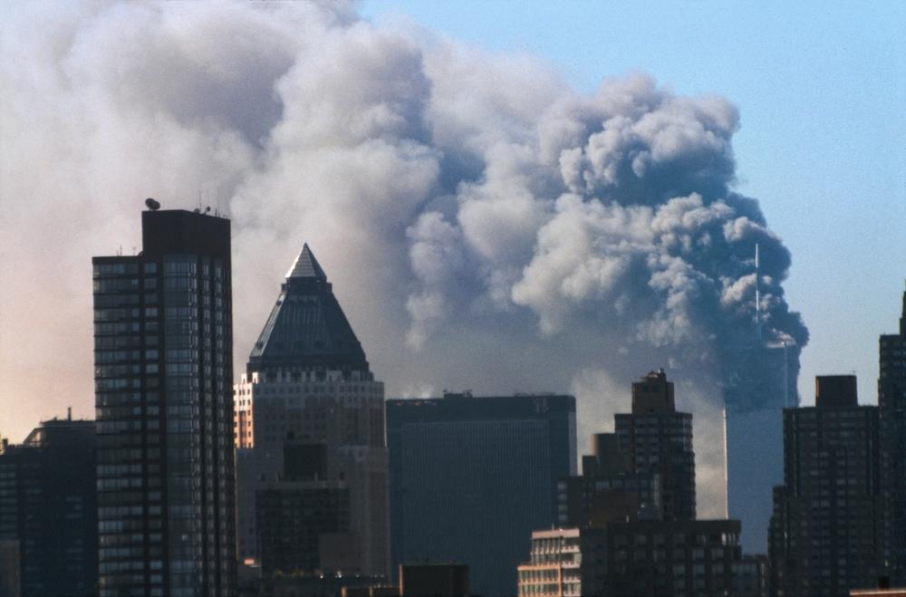 Large plume of smoke rising over the New York City skyline during the September 11 attacks